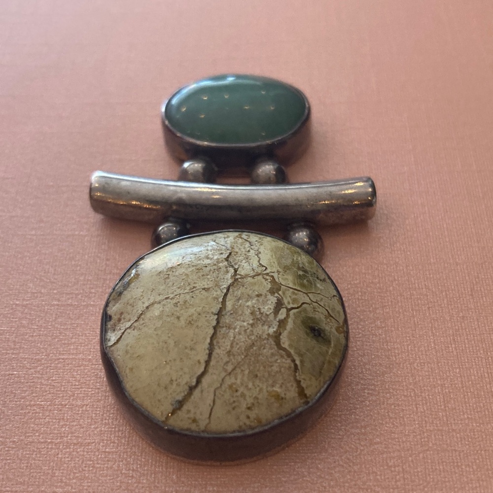 Unique Artisan silver and (unknown) stone pendant